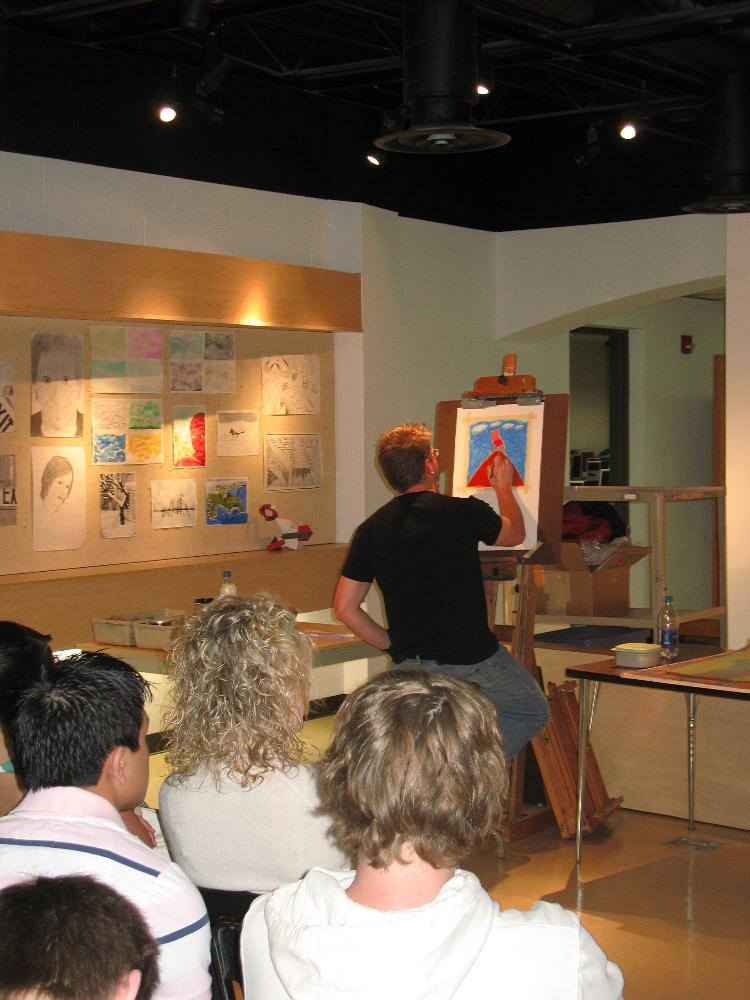 Michael Pfleghaar demonstrates oil painting for students.