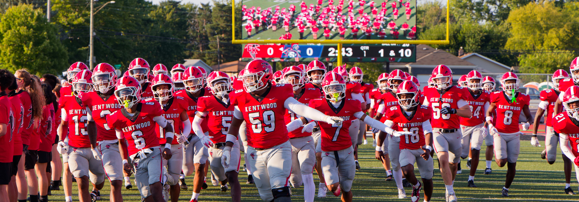 EK Football team running onto field