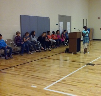Students wait patiently while another Brookwood student makes their speech.