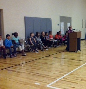 Students wait patiently while another Brookwood student makes their speech.