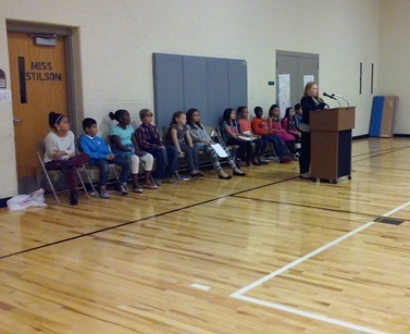 Students wait patiently while another Brookwood student makes their speech.