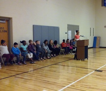 Students wait patiently while another Brookwood student makes their speech.