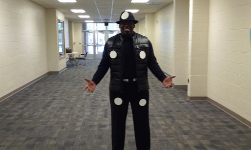 The principal, Mr. Bradshaw, shows off his domino costume!