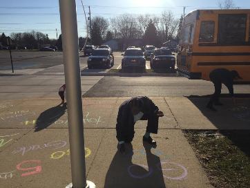 Someone is in the middle of writing an inspiring message for fifth grade!