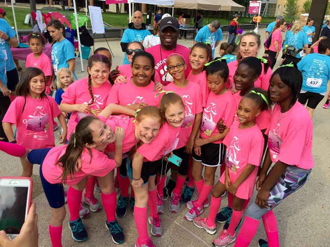 The Brookwood, Girl's on the run team, poses for a picture with the principal.