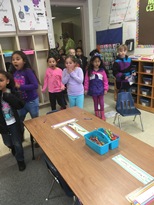 Shocked kindergartners as they see all the footprints left behind by the leprechaun.