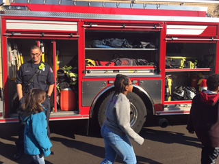 Students examine all the contents of the truck.